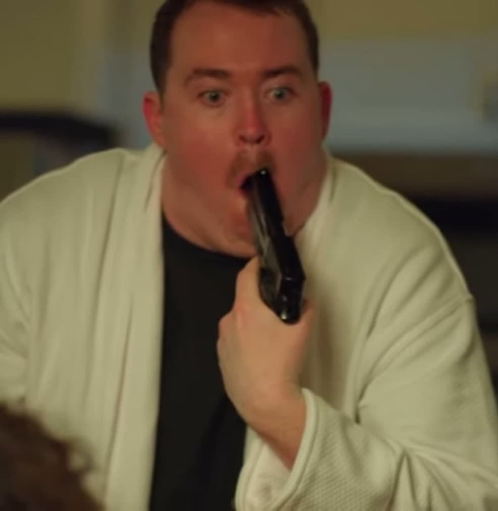 Shane Gillis with a gun in his mouth