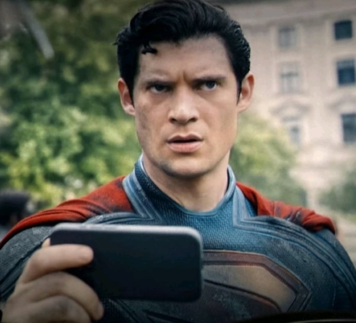 Superman looking at phone