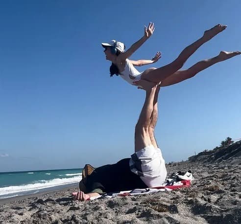 Bill Belichick doing beach yoga