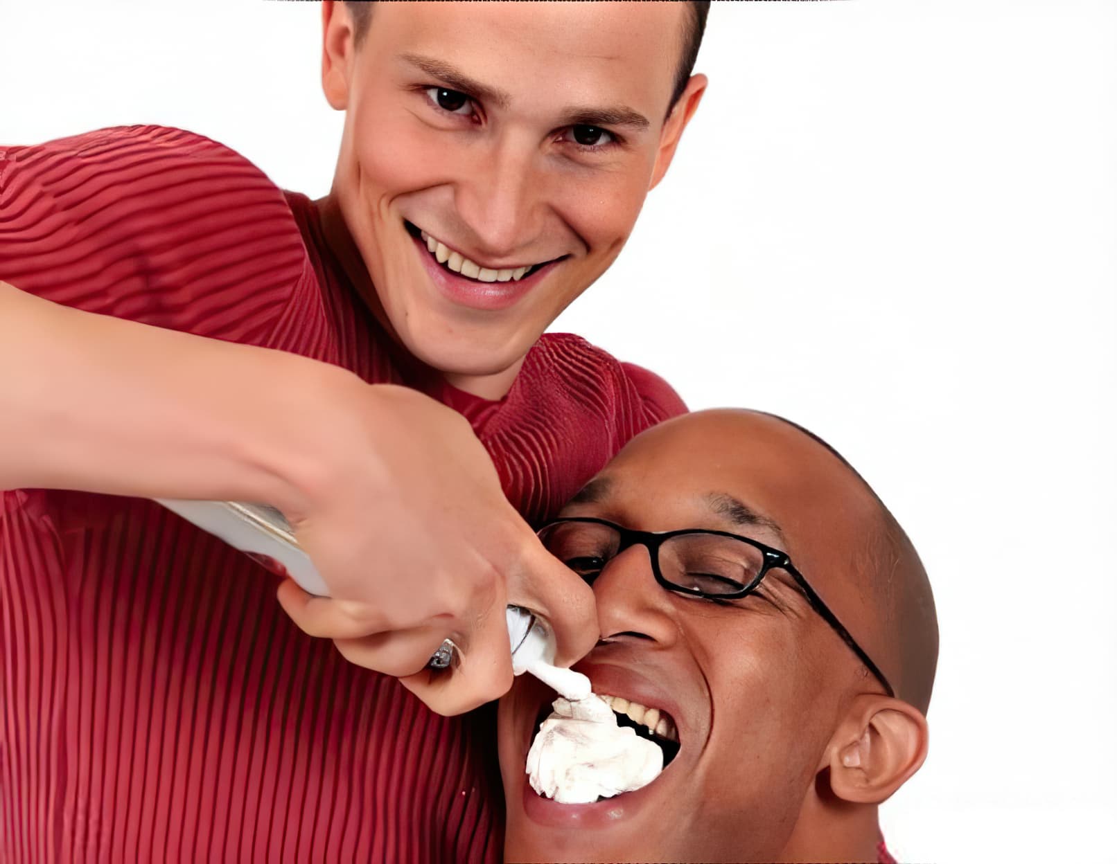 Guy feeding whipped cream