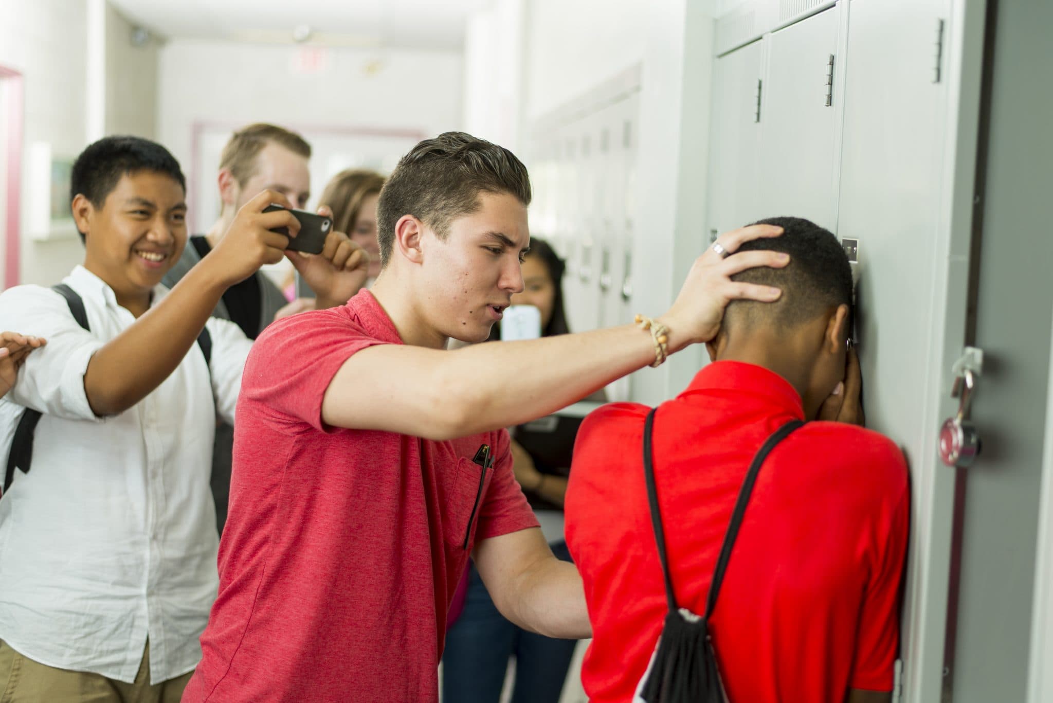 Locker bully pushing head