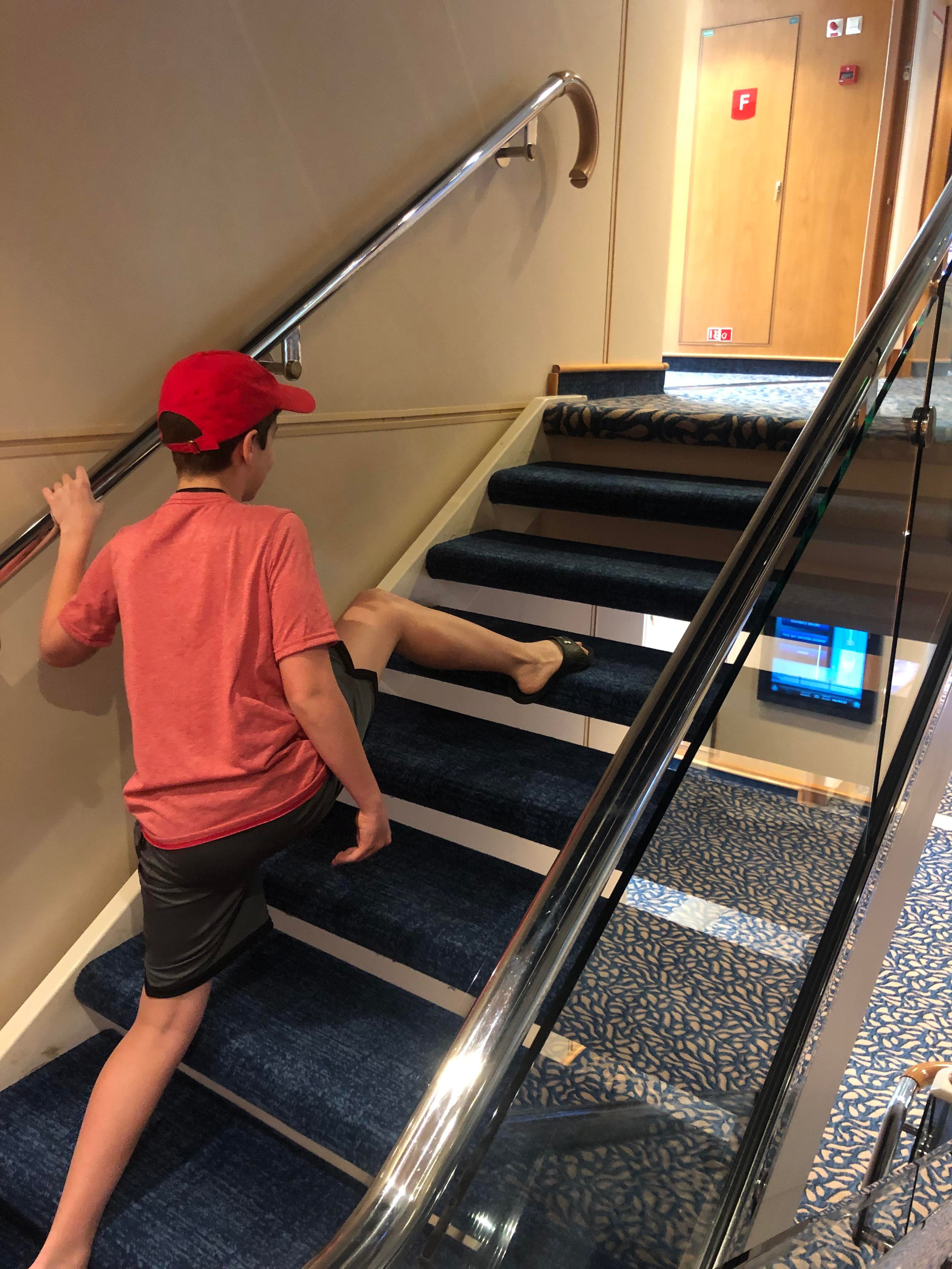 Kid climbing stairs wrong way
