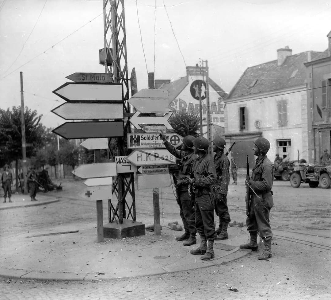 Soldiers looking at signs