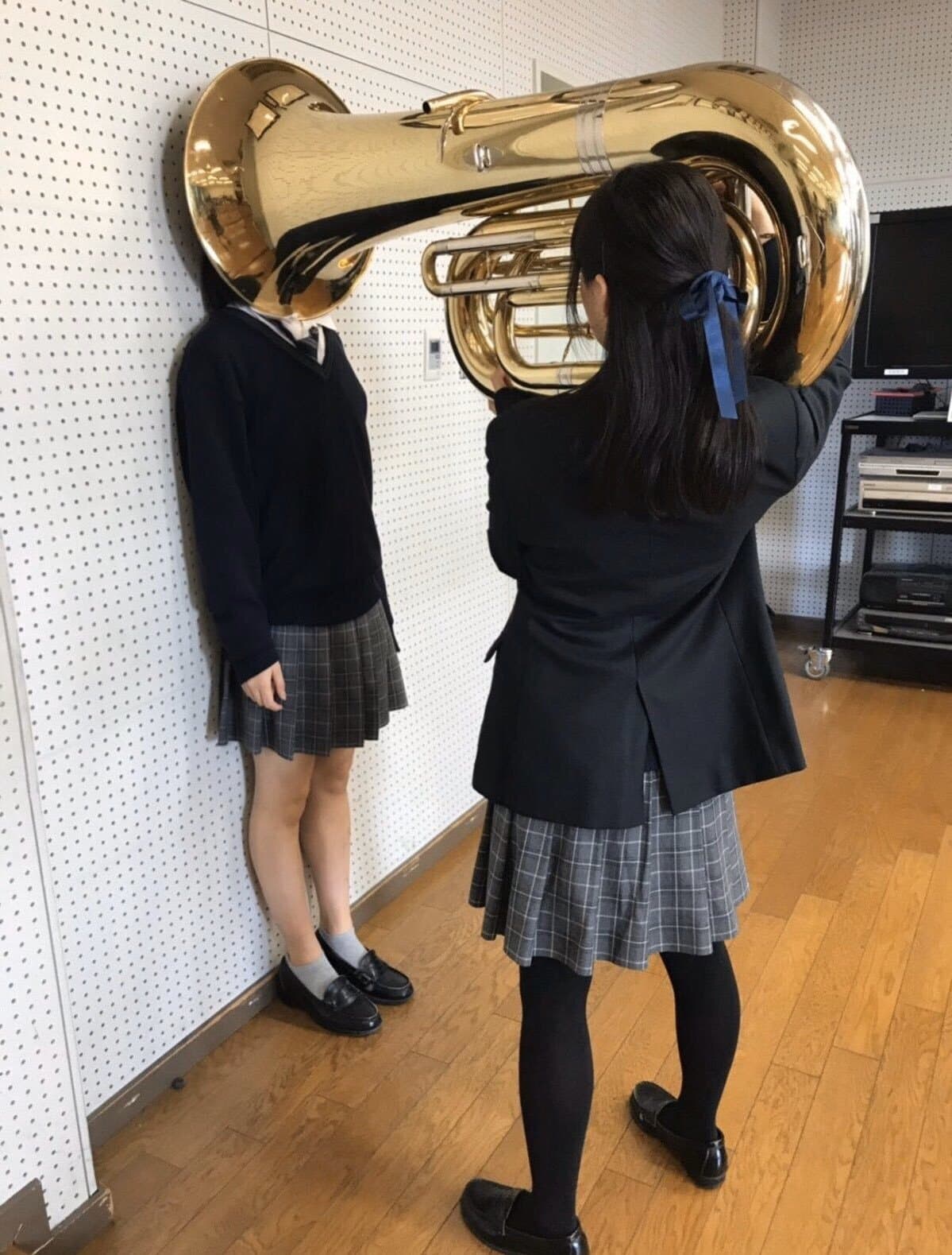 Tuba girl hitting