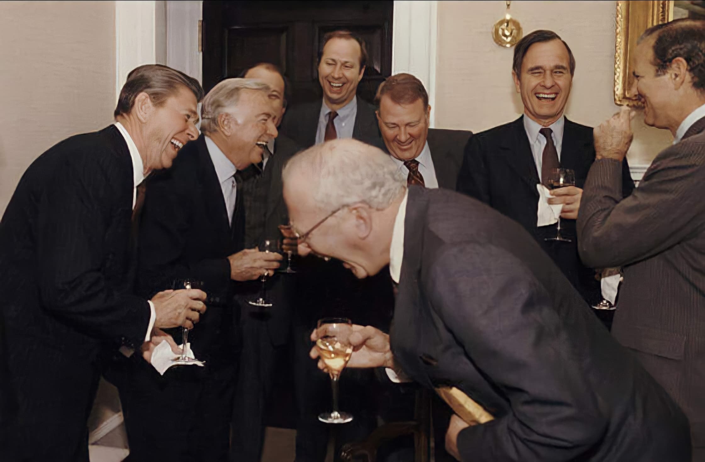 Reagan laughing with men