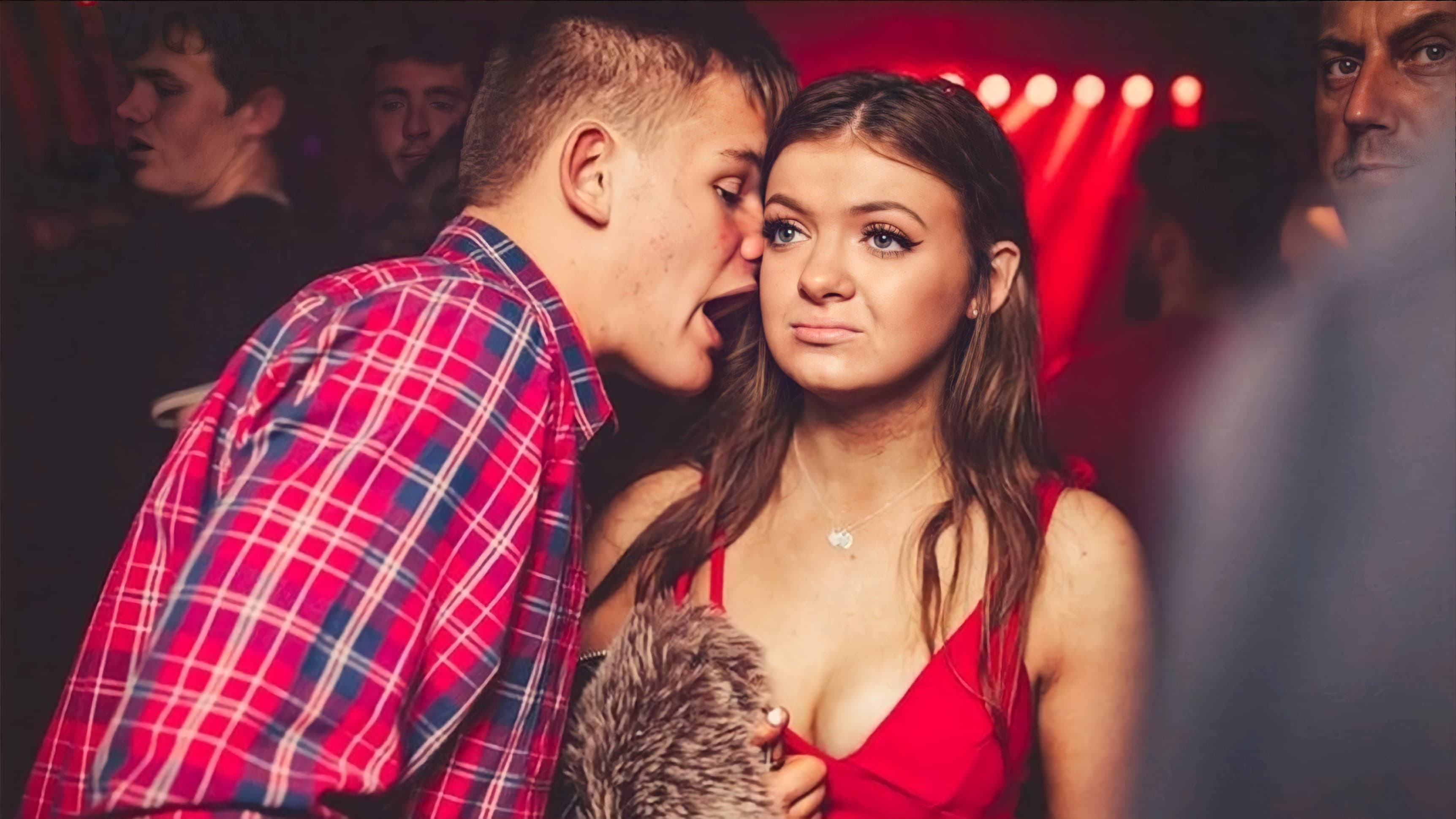 Guy whispering to girl